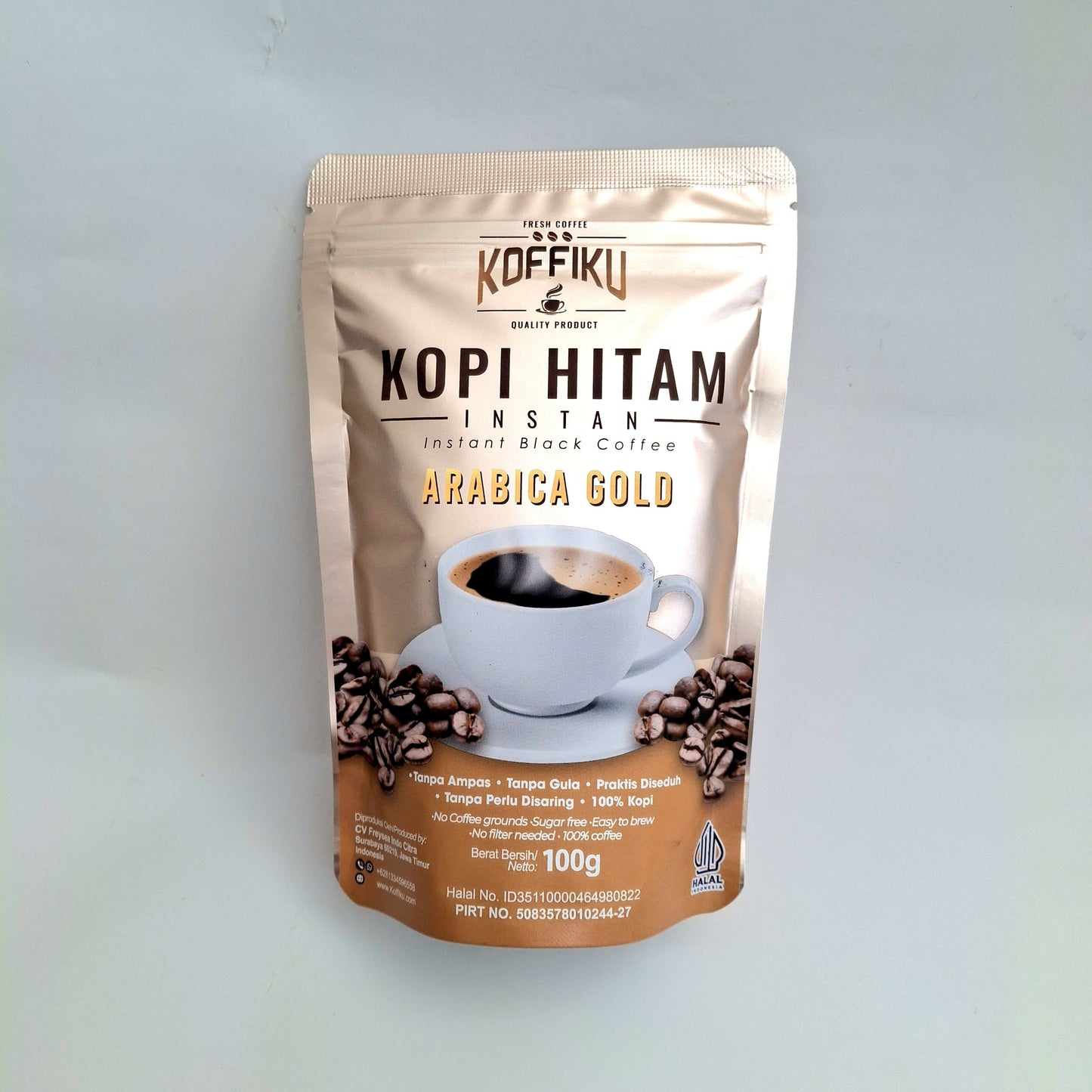 Koffiku Kopi Hitam Instant spray dried instant coffee Arabica Gold coffee package on a light gray background